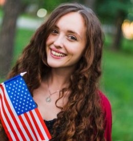 smiling-girl-with-american-flag-nature (1) smiling-girl-with-american-flag-nature (1)
