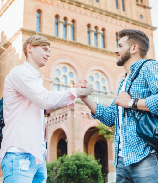 two-young-handsome-guys-students-with-backpacks-greet-each-other-campus-university (1) two-young-handsome-guys-students-with-backpacks-greet-each-other-campus-university (1)